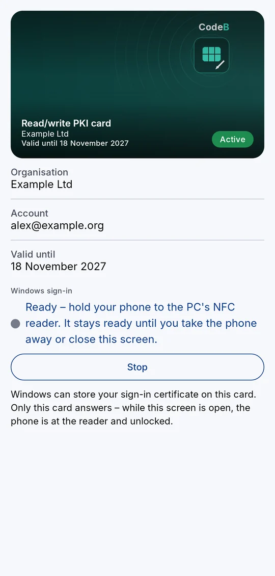CodeB Wallet acting as a PKI smartcard, held to a Windows PC's NFC reader for passwordless sign-in